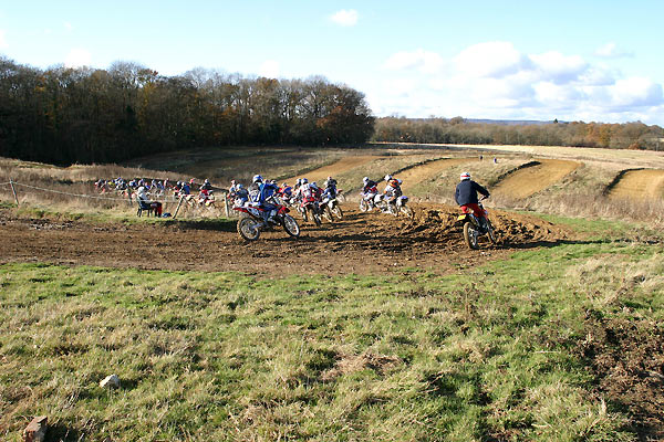 Young riders show off there skills at a local track. They look up to the people in supercross. 