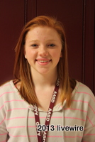 Ninth grade student Kiersten Young stands in front of the camera to get picture taken for County Chorus.
~Photo courtesy of Miranda Harkins