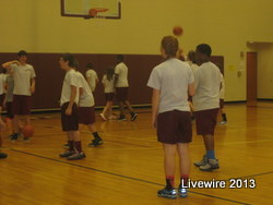 The students play basketball inside the B gym on a rainy day.
Photo by: Cassy Salyards