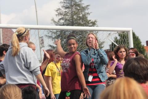 Cha-cha! Cassandra Hammel and Rejina Mencer dance to pump up the students. The students were waiting for the teachers to start calling out the winners names. 