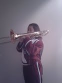 Tune it up! Emily Castillo prepares for Bandarama at the high school. She poses with her trombone. Photo by Ali Stalter