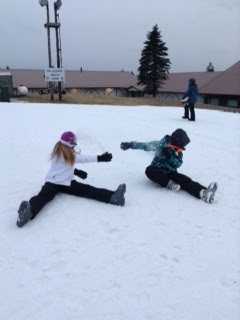 Sydney Starbird and Kristin Wineland play in the snow at Blue Knob Ski Resort. They are playing around in the snow before they get ready to ski.
Photo by Becca Gallace