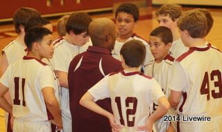 Coach Morris and the basketball team huddle up to talk about a play. Coach tried to get the boys fired up to win the game. He called a timeout to give them a break so they could calm down.
Photo By: Hanna Feathers