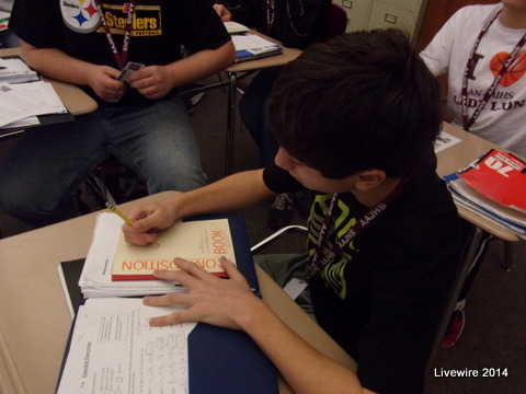 Good Work!  William Ajay is getting his notebook out so that he get his work done.  He also was being prepared and had his Spanish notebook out.  Photo by Jacob Hord