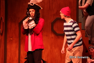 Ninth graders Michael Bruce and Hadley Hollern stand stage left while talking about Bruces hook. Bruce played the role of Captain Hooke. Hollern played the role of Smee. 
Photo by- Joanne Pringle