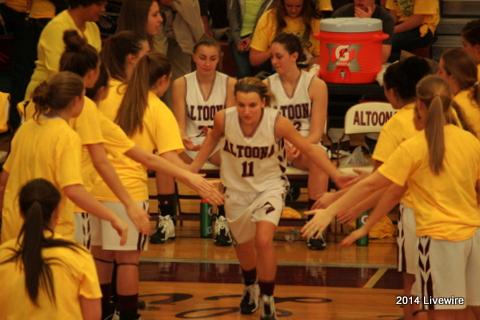 Twelfth grader, McKenzie Hatch, runs through the team to get pumped up to play Hollidaysburg. Kenzie has played on the high school basketball team for all three years that she has been in the high school. Photo by Hannah Barr