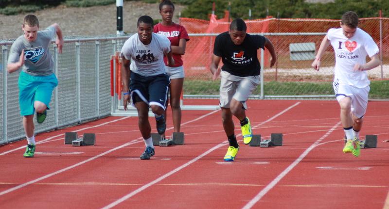 Ninth graders, Nick Carothers, Steve Franklin, Daiquain Watson and Jacob Deterline, practice for their next meet. Photo by Hannah Barr