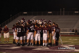 At the end of one of the teams game players huddle together after a post-game talk with the coaches. At the end of every game players would meet and talk with coaches as a group about the game. Photo by Mikayla Billotte