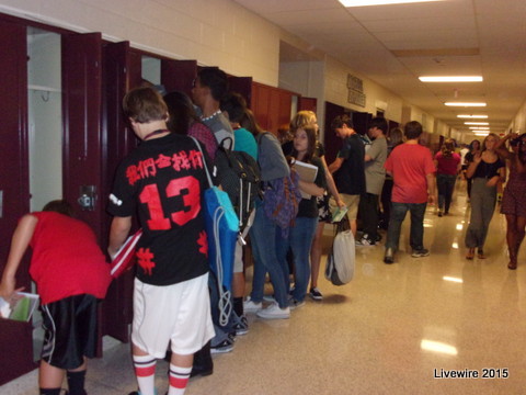 9th Grade students open their lockers in the AAJHS. Photo by Emily Simmons.