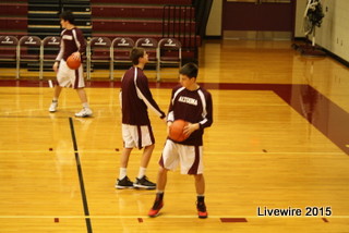 Maroon boys' basketball team gets ready for a game. Photo by Emily Simmons