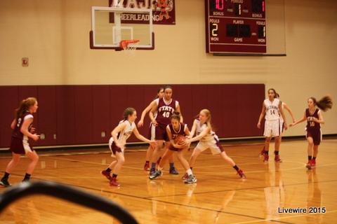 The seventh grade girls basketball team plays defensively against Mount Nittany in attempt to prevent them from scoring. The game for the girls occurred on Jan. 22 2015.