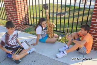 Pearl Lamborn, James Gallace and Tony Gallace talk before their band practice.  The band carried out their hour and a half practice after director Mr. Martin arrived at the field.  