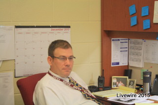 Mr. Robison at his at desk in the seventh grade office.  Picture by Mikey Baker.