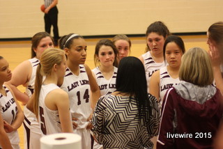 The ninth grade girls basketball team huddles in their game against BG.  Photo by: Baylie Horten