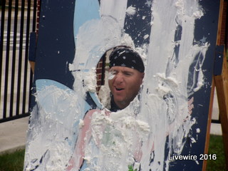 Seventh grade teacher Rocco Depiro gets a face full of whipped cream at Harvest Day.    Students could pay money to throw a paper plate of whipped cream at their teachers faces from a short distance.