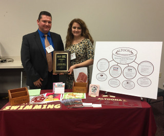 Mr.Dzurko and Mrs. Manack pose holding the TEEAP Award.