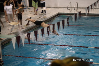 Ready, set, go! Ninth grader Rusty Focht dives in to begin his race. This was Fochts first home meet as a freshman.