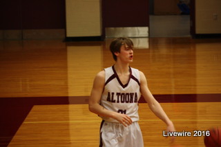 Shoot! Ninth grader Mason Criswell warmed up for the game along with the rest of the team. On Tuesday Jan. 17 the Altoona white boys basketball team competed against the Hollidaysburg tigers.