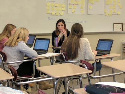 Student teacher Courtney Bauer works with the newspaper students on the topic of resumes.  Students are compiling portfolios to submit to a contest for the Journalism Education Association and Bauer is assisting with that project.  