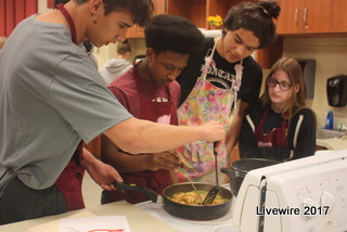 Team work! Freshmen students Dominik Clouser, Ben Walls, Roman Rojas and Abby Whitfield work on their assignment for the protein group. MyPlate divides foods into five groups- Vegetables, Fruits, Dairy, Grains, and Protein.