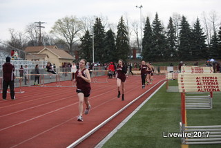 Running to the finish line!  Eighth grade track players Sarah Weathersbee and Elise Abbott race to get to the finish line during a meet.