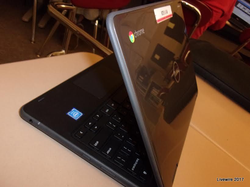 During the 2017-2018 year, the school district gave each eighth and ninth grader a Chromebook. They each included a  charger, case, and tag.
