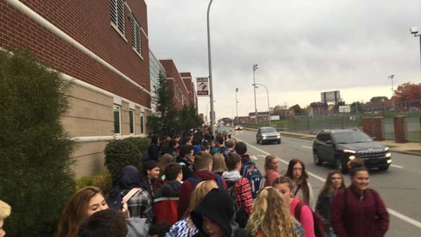 Students stand and wait outside to be checked by security at AAJHS on Tuesday, Nov. 7. 