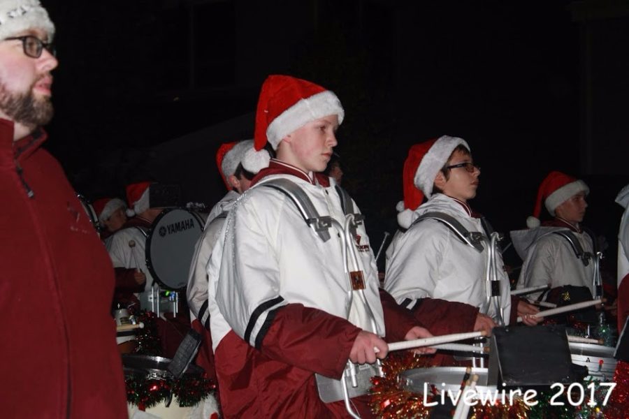 Jamen McCabe marches down the street at the Christmas Parade on Nov. 30. McCabe along with his fellow band members marched and played Christmas music.