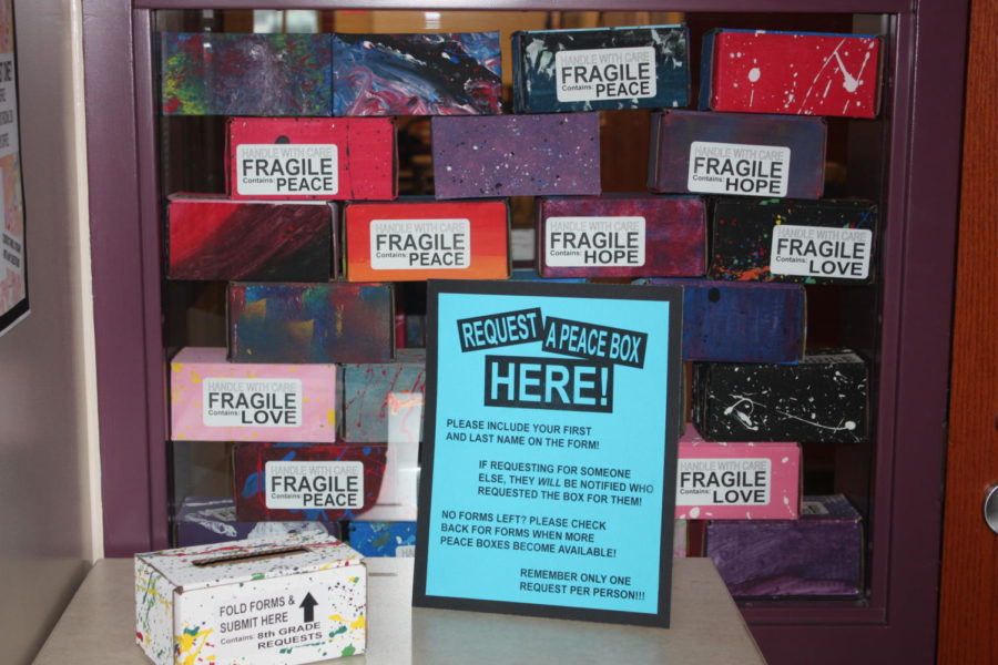 Nice and Bright! One of the stand for the peace boxes set up outside of Mrs. ORoarks room.  Students can fill out a slip and request a peace box.
Photo taken by Ben Blackie
