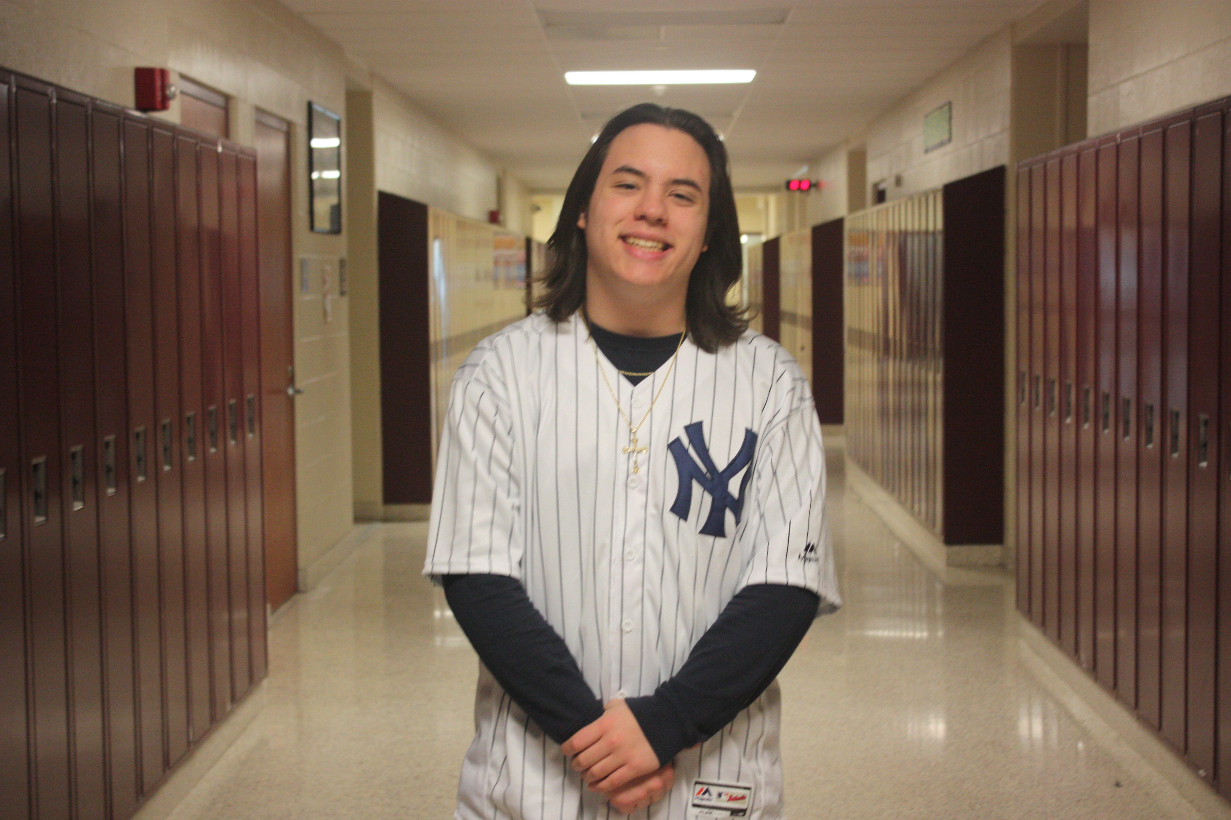 Ninth grader Cameron Passarello wore
a New York Yankees baseball home jersey , supporting #99 Aaron Judge , the outfielder.