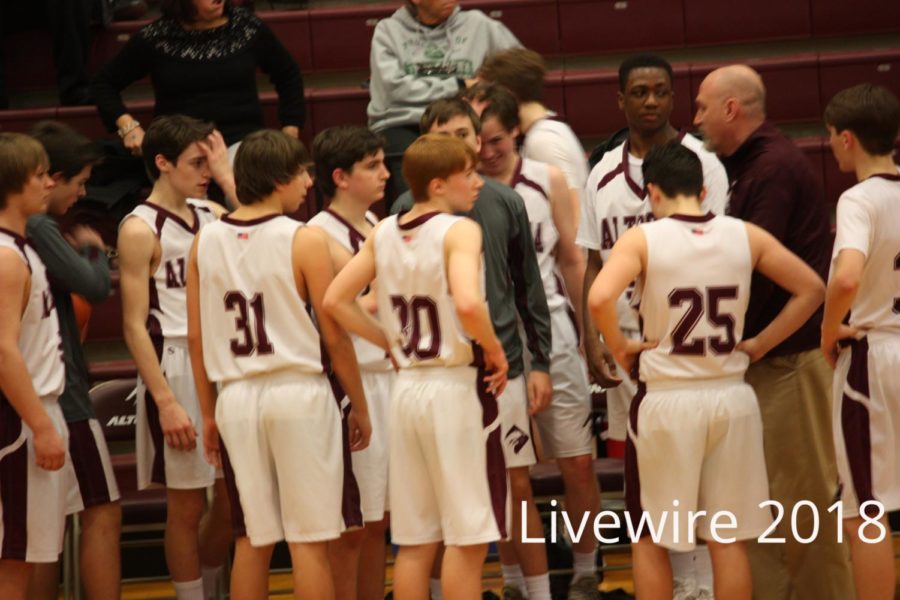 Ok+guys...+The+team+gets+pumped+up+before+their+game+on+Feb.+6.+The+team+talked+then+five+players+on+Altoonas+side+started+the+game.