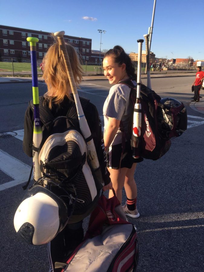 Eighth graders Rachel Dionis and Alana Cunningham get ready to go to a softball open gym.