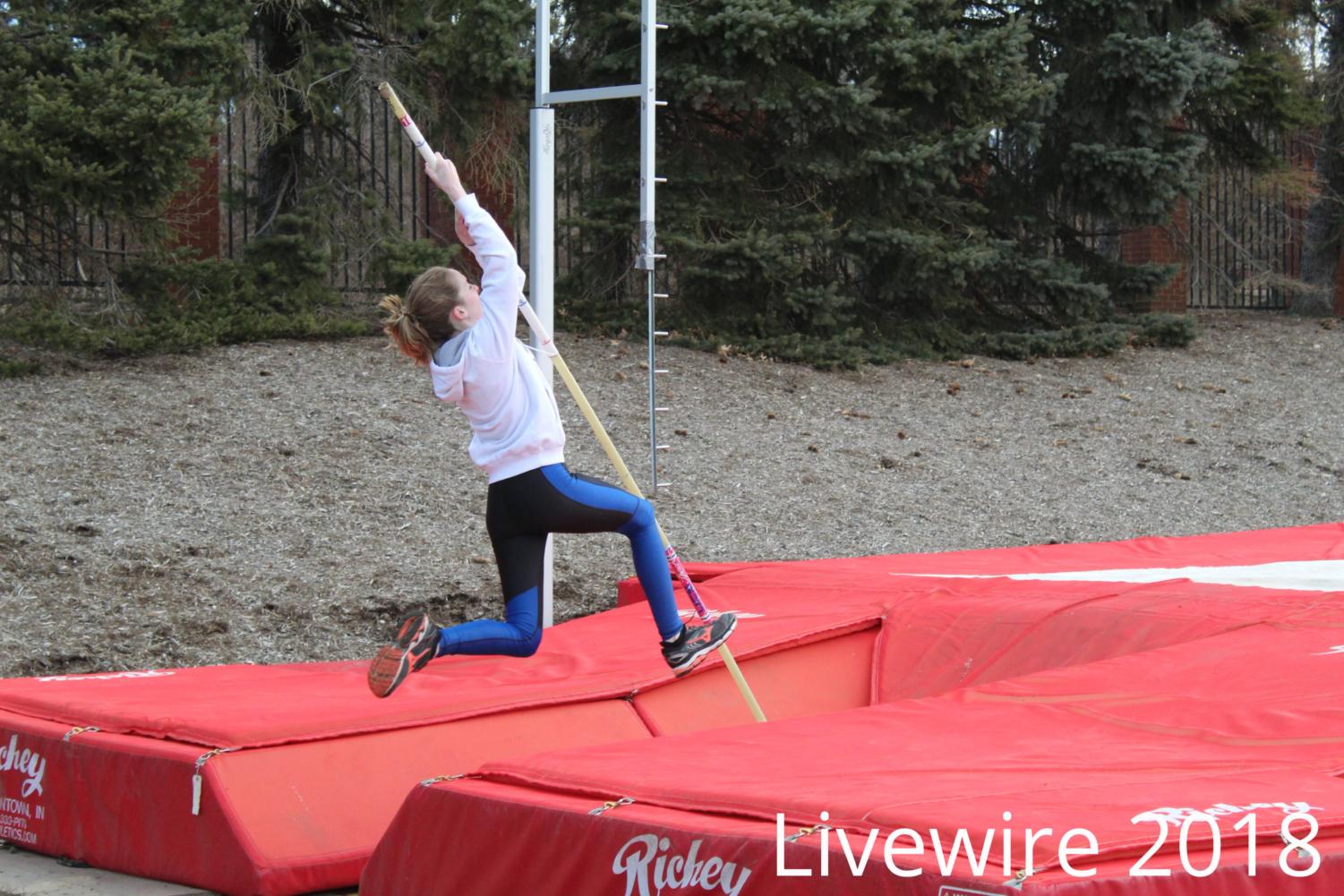 Jump! Mackenzie Kelley jumps for pole vault at track practice on March 17. Kelley jumped then got back in line with the other vaulters.