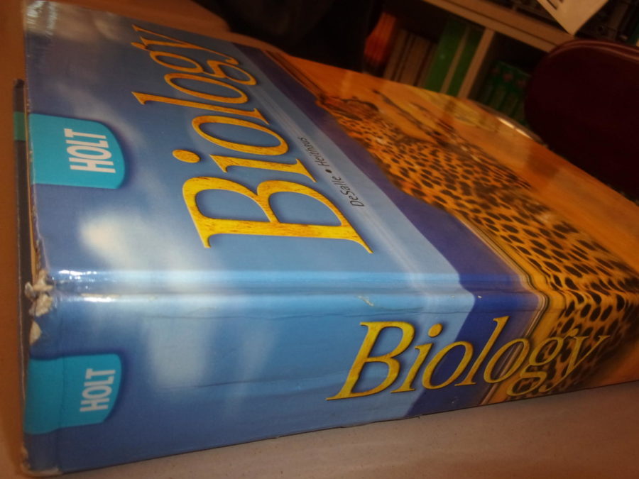 Looking sharp!  Ninth grade biology book helps students learn new concepts.  The book was made by the Holt company. 
