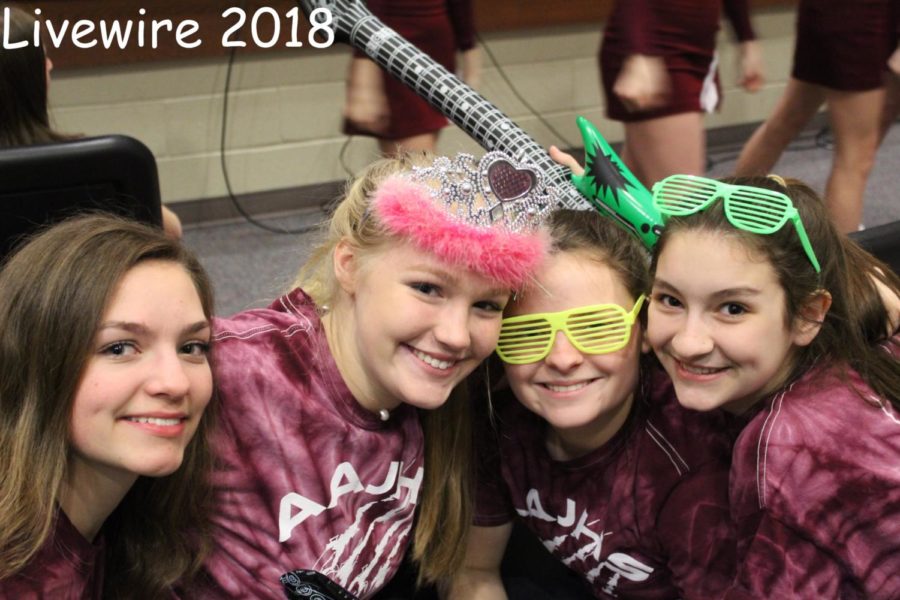 Isabella Frank, Alaina Koehle, Mya Crownover, and Eve Hogan are all showing their spirit by wearing maroon and white.