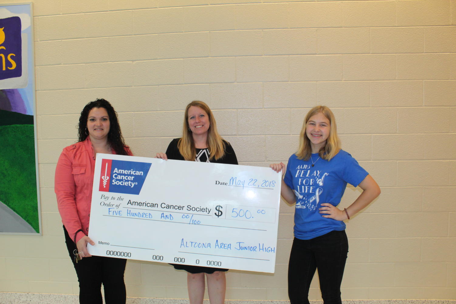 Julia Lane’s artistic work got chosen as the winner. The school also raised five hundred dollars. In the photo; Kristina Rose, FCS teacher; Shannon Warburton, American Cancer Society Senior Community Development Manager and Julia Lane, ninth grade student.