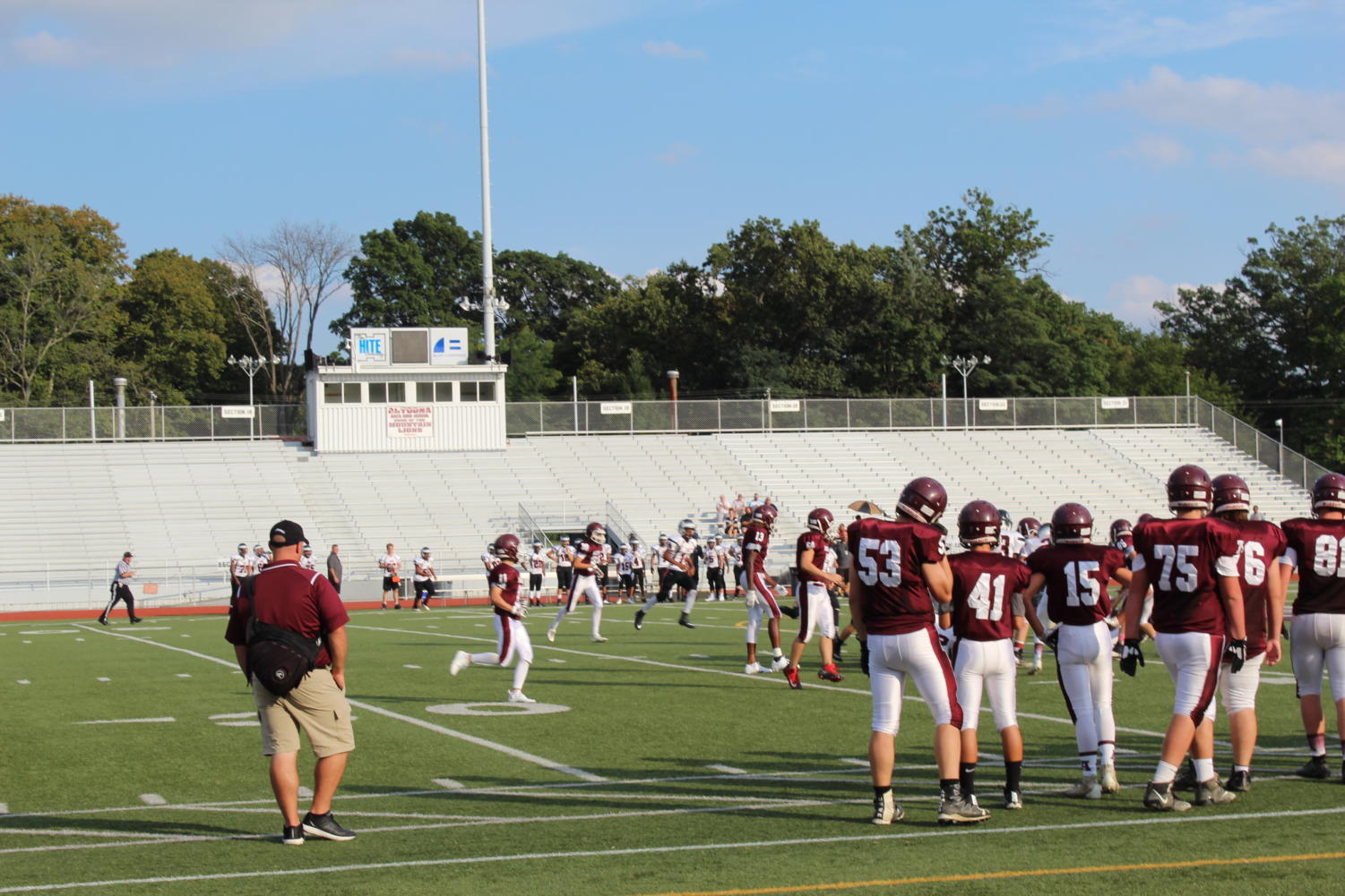 Play Hard, Work Hard
Players stand on the sideline cheering on their teammates. This game was held on Thursday, Sept. 20. The team went up against CD East on this day and won.