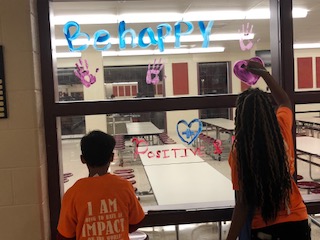 Lets Paint!
Two students that are a part of the Friends of Rachel Club paint hearts on the cafeteria windows. They were trying to spread kindness.