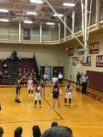 Eighth grader Taylor Lane takes a foul shot.  This shot started the game.