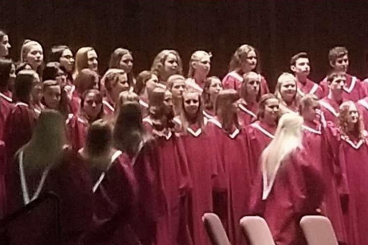 The vocal ensemble is beginning to line up on stage.  The chorus were preparing to perform their first song,  Aurora Borealis.