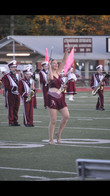 Marching+along%21+On+Oct.+24%2C+Danielle+Bardelang+marches+down+the+field+in+her+feature+costume.+Danielle+is+the+majorette+captain+and+had+the+opportunity+to+be+a+soloist+at+her+last+game.