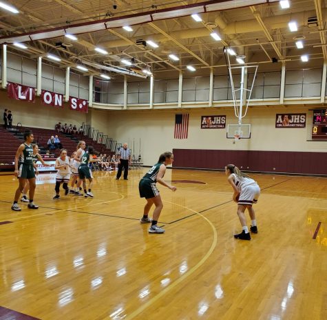 Shoot it!
Eighth grader Kaylee Harpster plays offense in her basketball game on Dec. 16. The teams works together to beat their opponents.