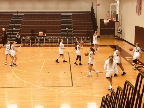 Shoot it!
The ninth grade girls' varsity basketball team warms up for their game against Cumberland Valley. The girls worked together the whole game but were defeated.