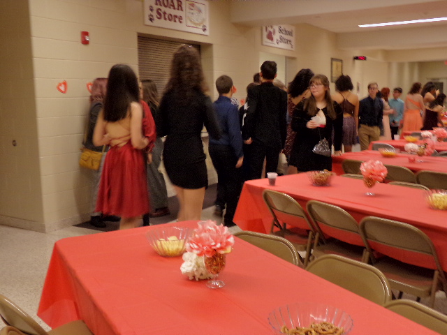 Get ready to dance. Eighth grade students get snacks at their dance. The eighth graders at Sweethearts danced and socialized with their friends. 
