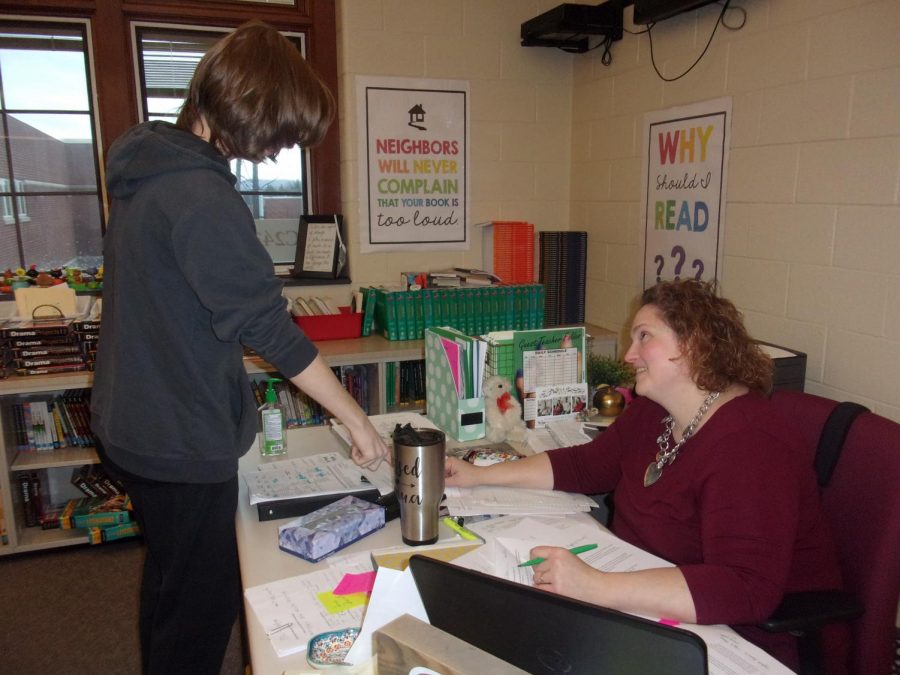 Betsy Cron shares information about a reading workshop assignment. She has been teaching the curriculum since Jan. 13. 