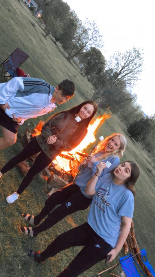 On Friday May 22, ninth graders Kristina Lepore, Peyton Daniel, Kadence Zerbey and Connor Lindsey celebrate going into the yellow phase by having a fire. This was the first time they have hung out since the lockdown was put in place.  