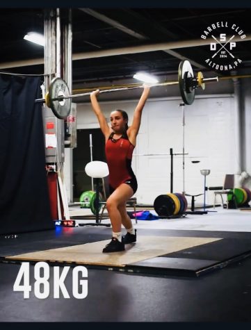 Pull, squat, jerk! Gracie Rice performs her final clean and jerk attempt at Youth Nationals. Freddie, the coach, also Rice’s uncle, encouraged her to try Olympic Weightlifting, which she eventually did and really enjoyed it.

