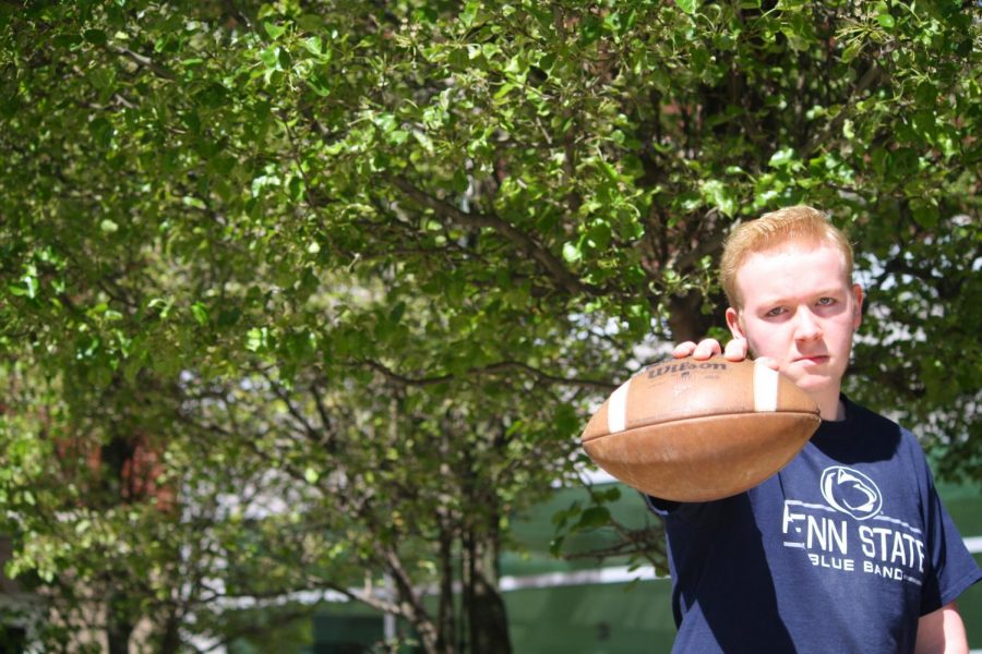 Go long! Randy Grove, lineman for the football team, poses with his favorite item, a football. Grove cannot wait for the season to come around again and for his high school football career to begin. 