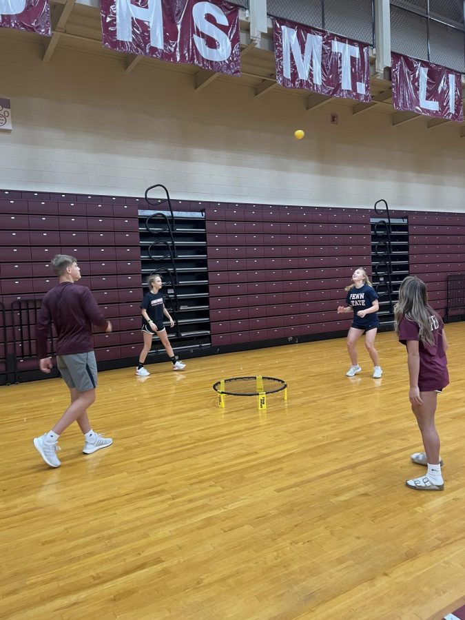  Competitive fun! Mark Harrington, Ava Steinbugl, Rowan DiSabato and Ellaina Saylor take part in a game of competitive spike ball. The game began right before the teachers called everyone into the other gym to announce the winners of the raffle baskets. 