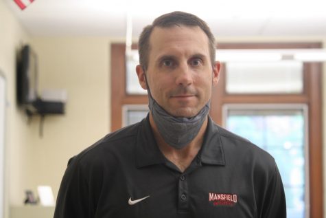 Feeling confident! Neatrour smiled for the camera. Having his name in his colleges hall of fame only fuels his confidence as a coach.